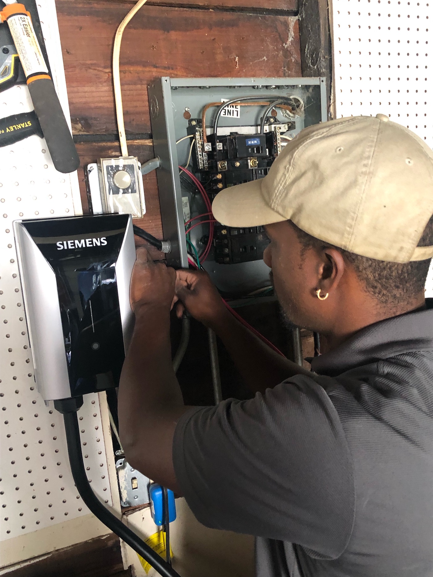 man installing electric unit